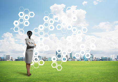 Elegant businesswoman outdoors with camera instead of head and media interface on screenの写真素材