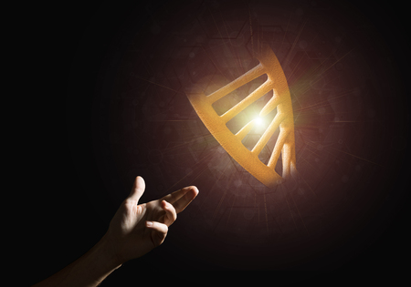 Close of man hand presenting DNA molecule research as concept. Mixed mediaの写真素材