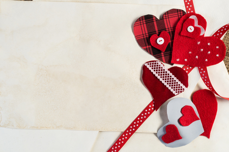 Handmade love hearts and sheets of blank paper の写真素材