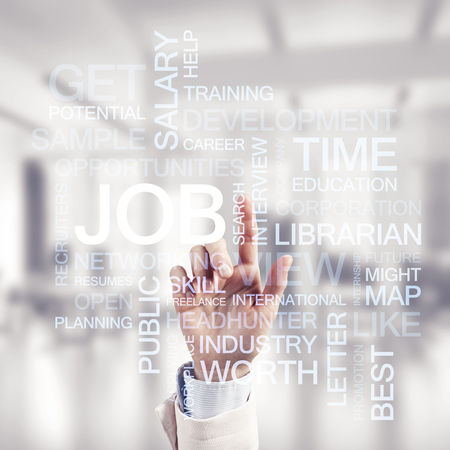 Close of businesswoman hand touching with finger screen with business conceptual wordsの写真素材