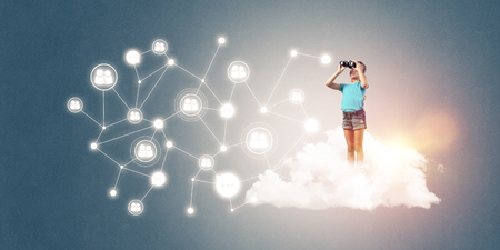 Cute smiling kid girl on cloud presenting social connection conceptの写真素材