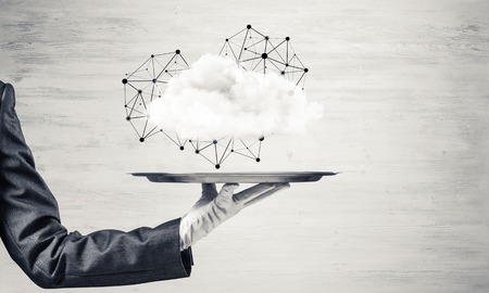 Cropped image of waitress's hand in white glove presenting cloud with social media network structure...