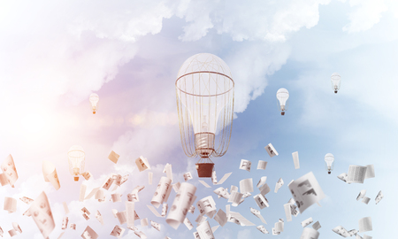 Colorful aerostats flying among paper documents and over the blue cloudy sky. 3D rendering.の写真素材