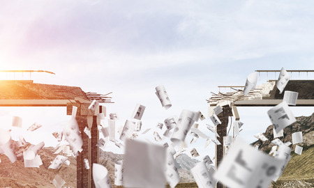 Broken concrete bridge with flying papers among high mountains and cloudly skyscape on background. 3D rendering.の写真素材