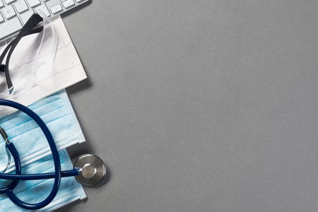 High angle shot of medical items on gray surfaceの写真素材