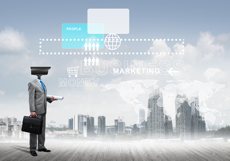 Businessman with camera instead of head and media user interface on screenの写真素材