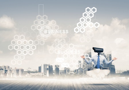 Elegant businessman outdoors floating on cloud and camera instead of headの写真素材