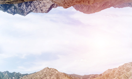 Abstract image of two nature worlds located upside down to each other on sky background. Wallpaper, backdrop with copyspace.の写真素材