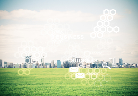 Concept of modern technologies with media icons on screen and business city at backgroundの写真素材