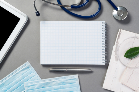 High angle shot of medical items on gray surfaceの写真素材