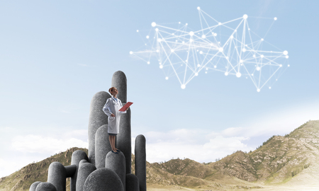 Young female doctor with folder in hands satnding on stone column. 3d renderingの写真素材