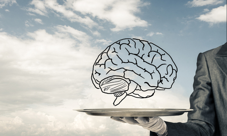 Cropped image of waitresss hand in white glove presenting sketched brains on metal tray with cloudy skyscape on background. 3D rendering.の写真素材