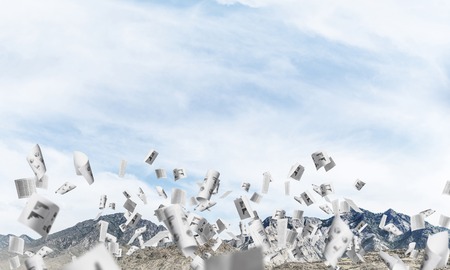 Beautiful nature landscape with flying papers among high mountains and cloudly skyscape. 3D rendering.の写真素材