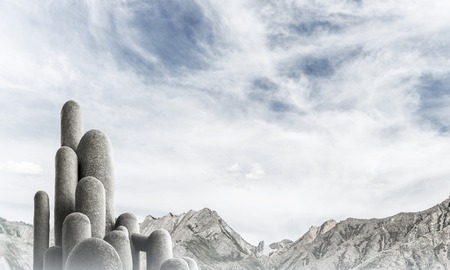 Image of high and huge stone columns located outdoors with beautiful landscape on background....