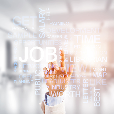 Close of businesswoman hand touching with finger screen with business conceptual wordsの写真素材