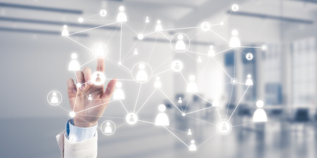 Close up of businesswoman hand touching network concept on screenの写真素材