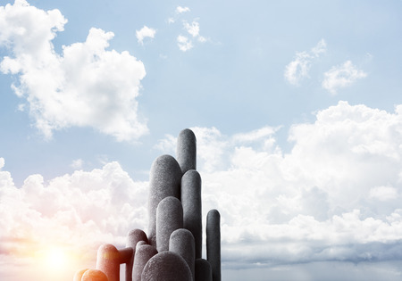 Image of high and huge stone columns located outdoors with beautiful landscape on background. Wallpaper, backdrop with copyspace.の写真素材