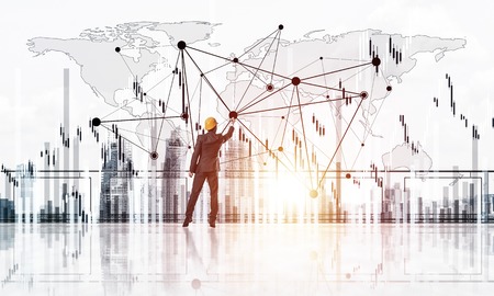 Young engineer in suit at balcony against morning cityscape background. 3d renderingの写真素材