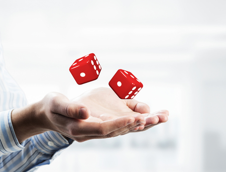 Close of businessman hands with dice as game concept. Mixed mediaの写真素材