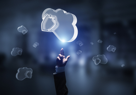 Close of businessman hand touching glass cloud computing concept. Mixed mediaの写真素材