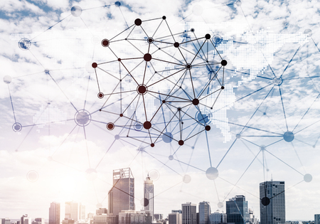 Modern cityscape with buildings and skyscrapers and social connection concept on screenの写真素材