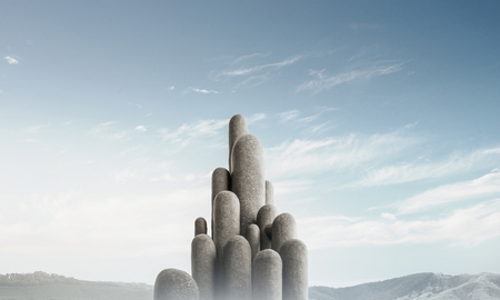 Image of high and huge stone columns located outdoors with beautiful landscape on background. Wallpaper, backdrop with copyspace.の写真素材