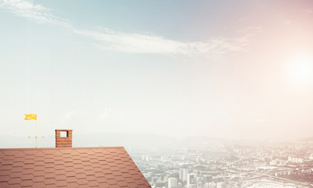 Brick house roof and urban landscape at backgroundの写真素材