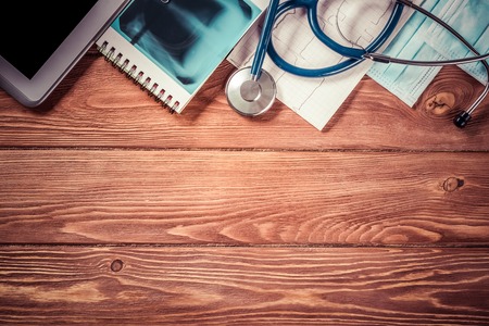 High angle shot of medical items on wooden tableの写真素材