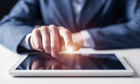 Digital technologies in modern business concept. Businessman hands using tablet computer. Virtual interface on tablet computer screen. 3d data visualization at gadget. Online marketing and analyticsの写真素材