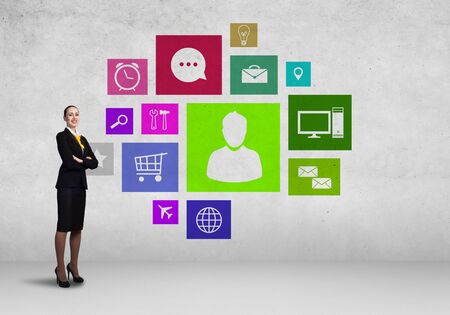 Businesswoman and color application icons at backgroundの写真素材