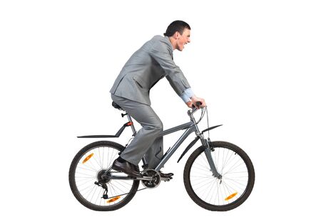 Businessman on bike hurry to work. Young man scared to be late. Corporate employee in grey business suit riding bicycle. Male cyclist isolated on white background. Rush hour in morning conceptの写真素材