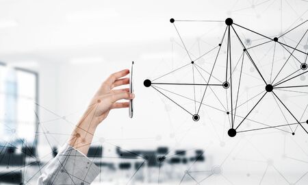 Close up businessman hand using smart phone and connection lines as concept. 3d renderingの写真素材