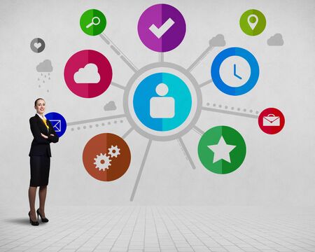 Businesswoman and color application icons at backgroundの写真素材