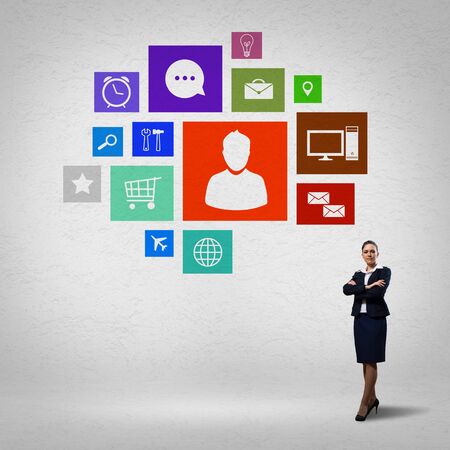 Businesswoman and color application icons at backgroundの写真素材