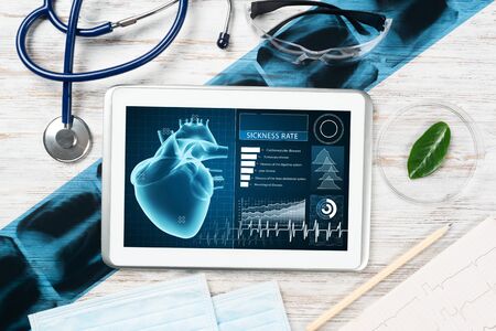 Medical diagnostics in modern hospital. Tablet computer with medical application interface on...