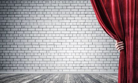 Close up of businessman hand open red velvet curtain. Place your textの写真素材