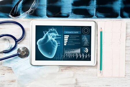 Medical diagnostics in modern hospital. Tablet computer with medical application interface on...