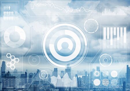 Double exposure business concept with abstract financial graphics on background of modern cityscape....