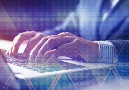 Innovation technology in modern corporate business. Virtual geometric graphic hologram. Businessman works in office with laptop. Abstract concept of internet network. Double exposure imageの写真素材