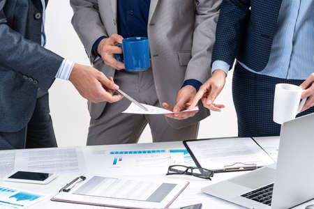 Business partnership concept with business people. Office desk with financial analytics. Business meeting in conference hall. Presentation and discussion of new startup project. Strategy developmentの写真素材