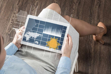 close-up business woman with computer tablet on lap