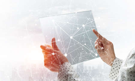 Businesswoman works with futuristic interface. Virtual geometric graphics with plexus effect and...