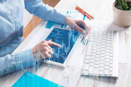 Manager using tablet computer with blank screen. Close up woman hand pointing on touchscreen....
