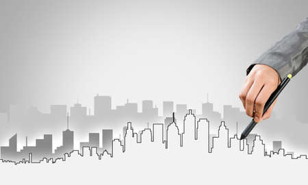 Hand of man designer drawing with stylus construction projectの写真素材