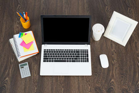 close-up of the businessmans workplace, laptop, office and calculator