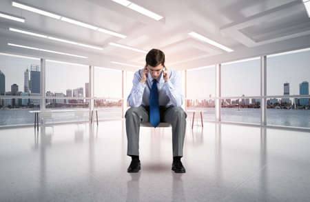 young businessman focused on his thoughts, concentrating on the taskの写真素材