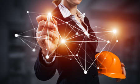 Businesswoman pointing on abstract network structure.の写真素材