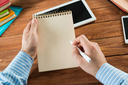 close-up of hands with notepad. office work