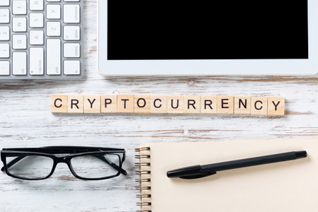 Cryptocurrency concept with letters on cubes. Blockchain technology and digital money. Still life of...