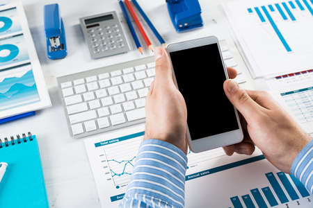 close-up of mens hands with a phone. Office work